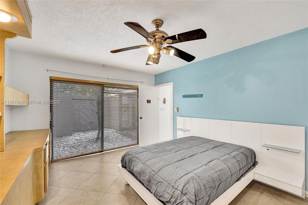 This room, immediately  to the left of entrance can be an office, bedroom or guest room with the attached bath