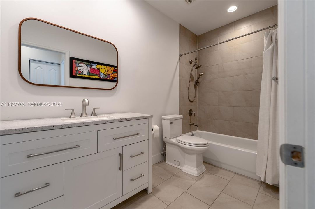 Full bathroom with tub