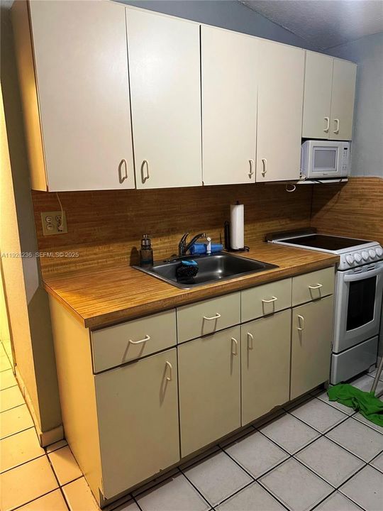 BIG  KITCHEN CABINET, WITH SINK, AND ELECTRIC STOVE