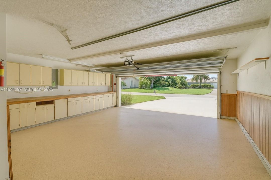 Built ins in the 2 car + golf cart side entry garage.
