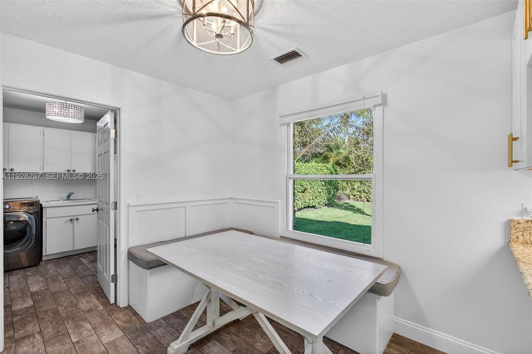 Behind the built in bench is the laundry and utility room