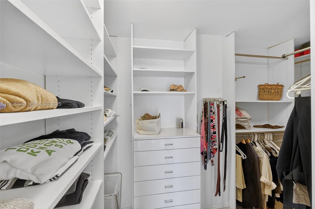 PRIMARY BEDROOM CLOSET, ONE OF 2 WALK-IN CLOSETS