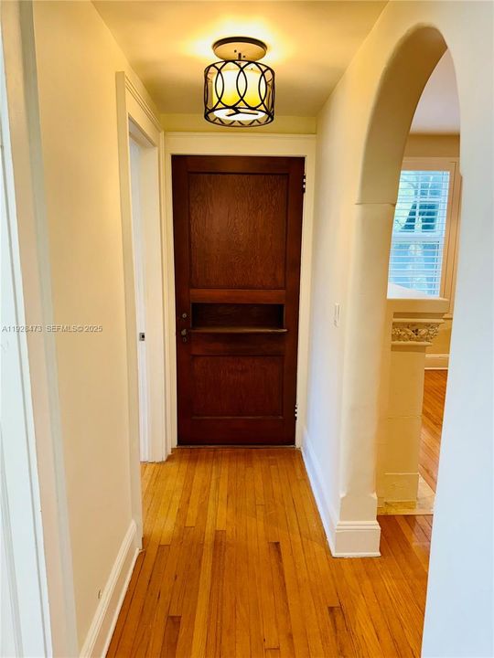 Hallway with original ornate door