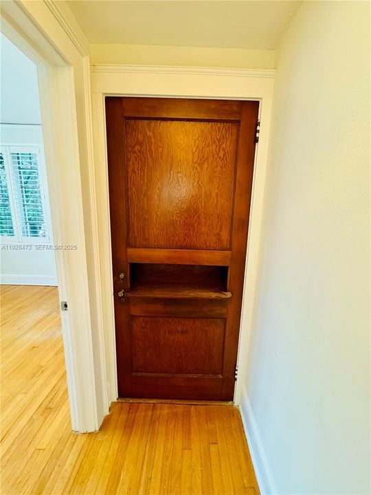 Hallway with original ornate door