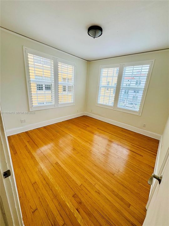 Second bedroom corner unit plenty of natural light will fit a King bed.