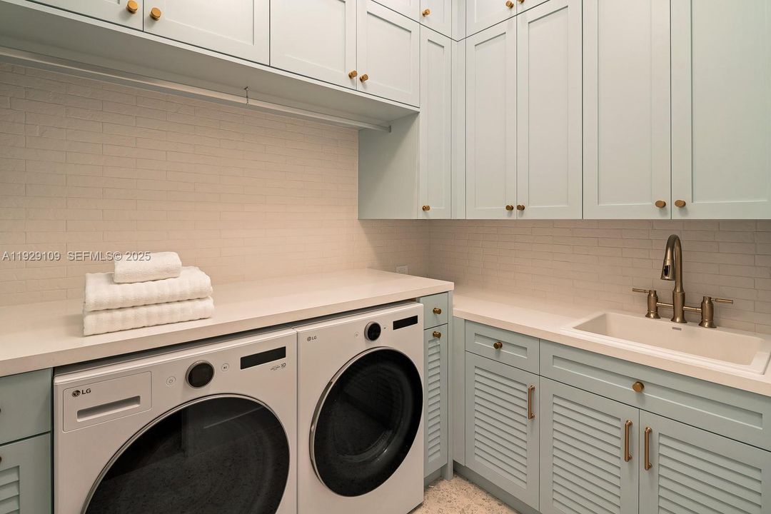 Laundry Room With Double-Hung Cabinetry