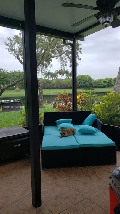 Screened porch with a beautiful lake view.