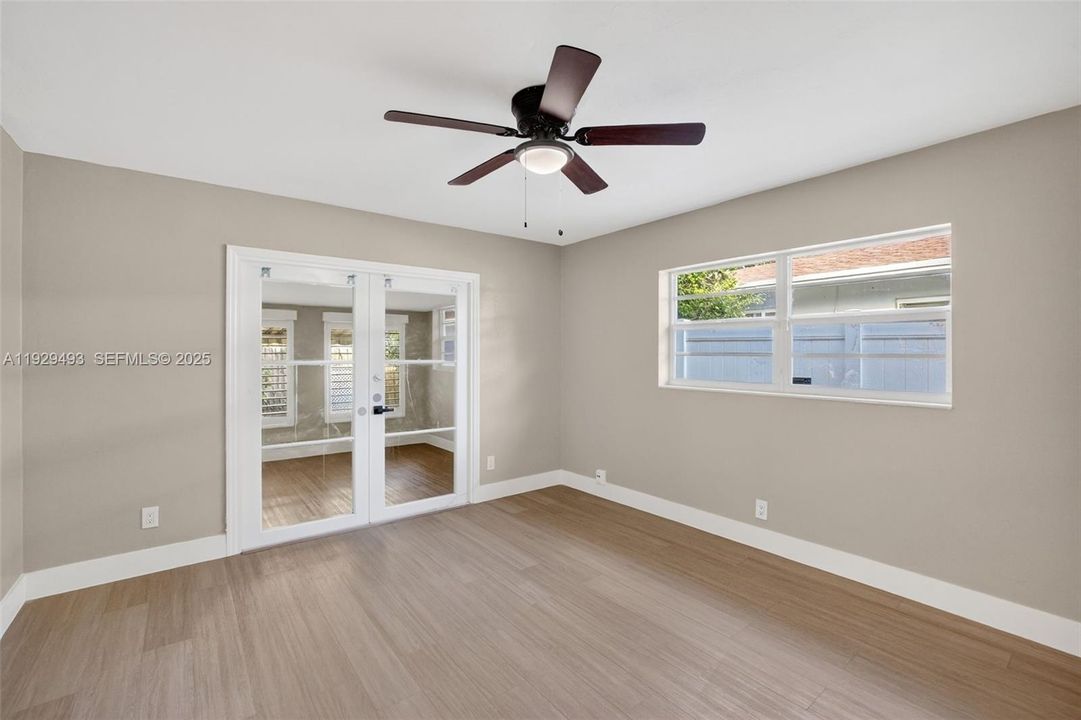 Unit 2 2nd bedroom w/ entry to florida room and rear