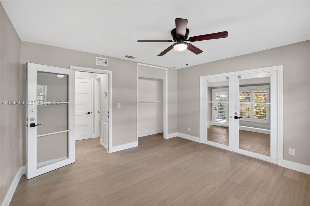 Unit 2 2nd bedroom w/ entry to florida room and rear