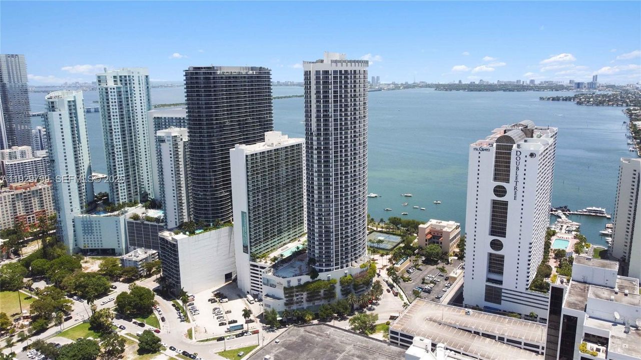 Sky-high perspective of 1750 N Bayshore Dr showing proximity to Margaret Pace Park, Miami Beach, and top city attractions.