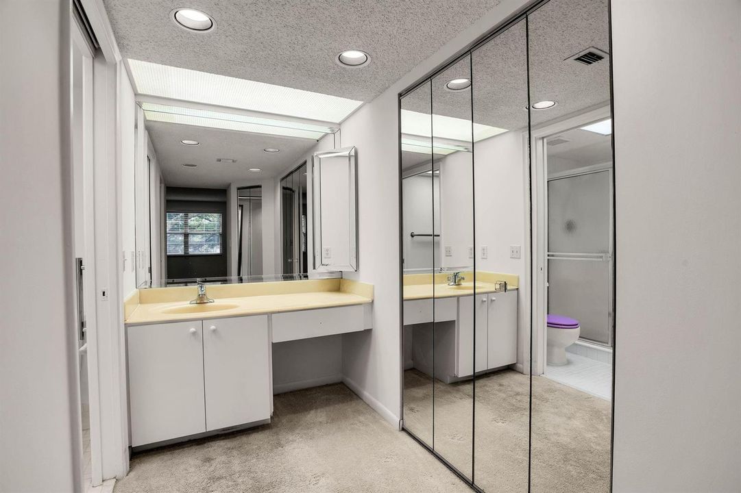 MASTER BATHROOM HIS/HER CLOSETS