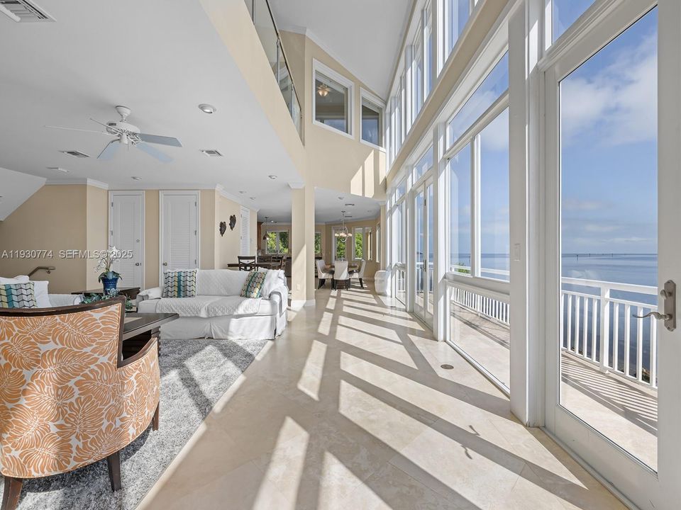 Double height, all glass paneled water views