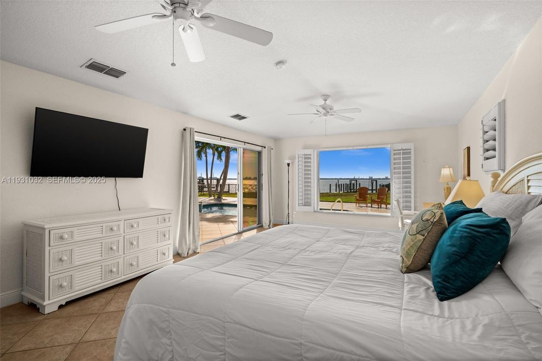 Primary Bedroom with sliding door to the pool