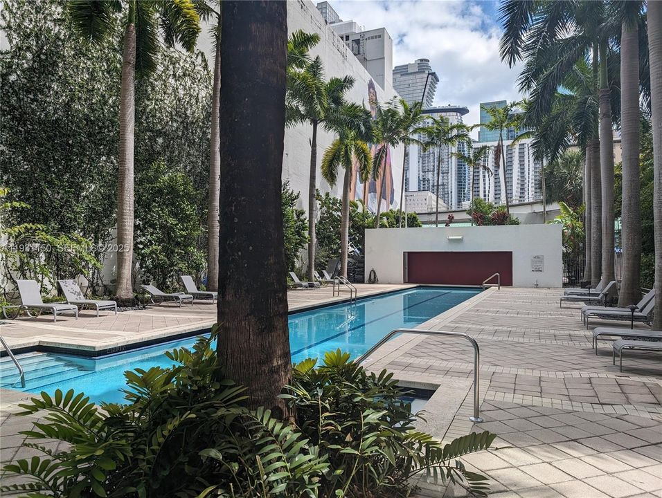 Ground floor pool has waterfall.