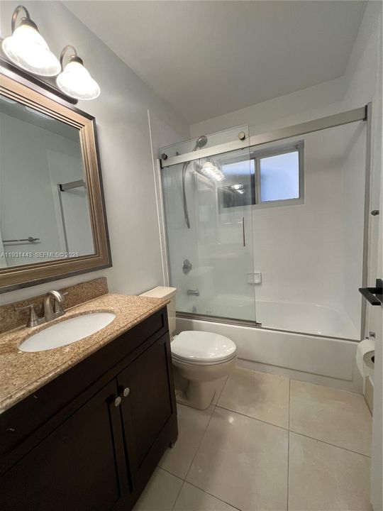 hall bathroom with tub