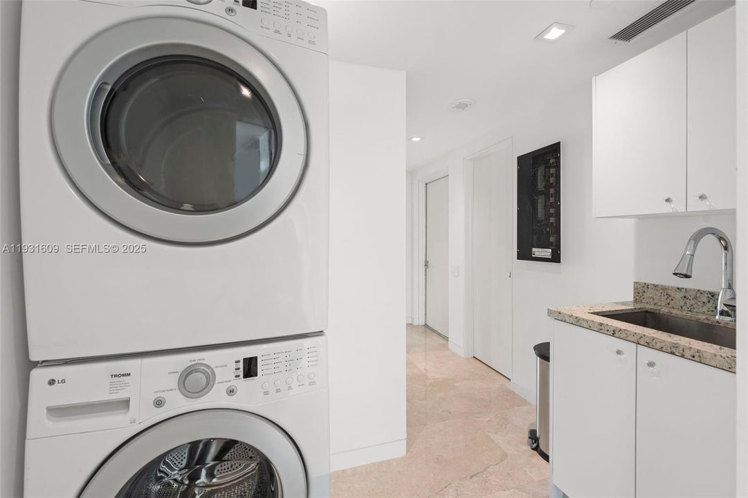 Laundry Room with direct access to upper level service area and service elevator