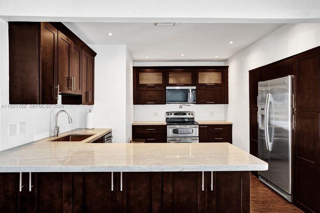 Breakfast counter with storage on both sides.