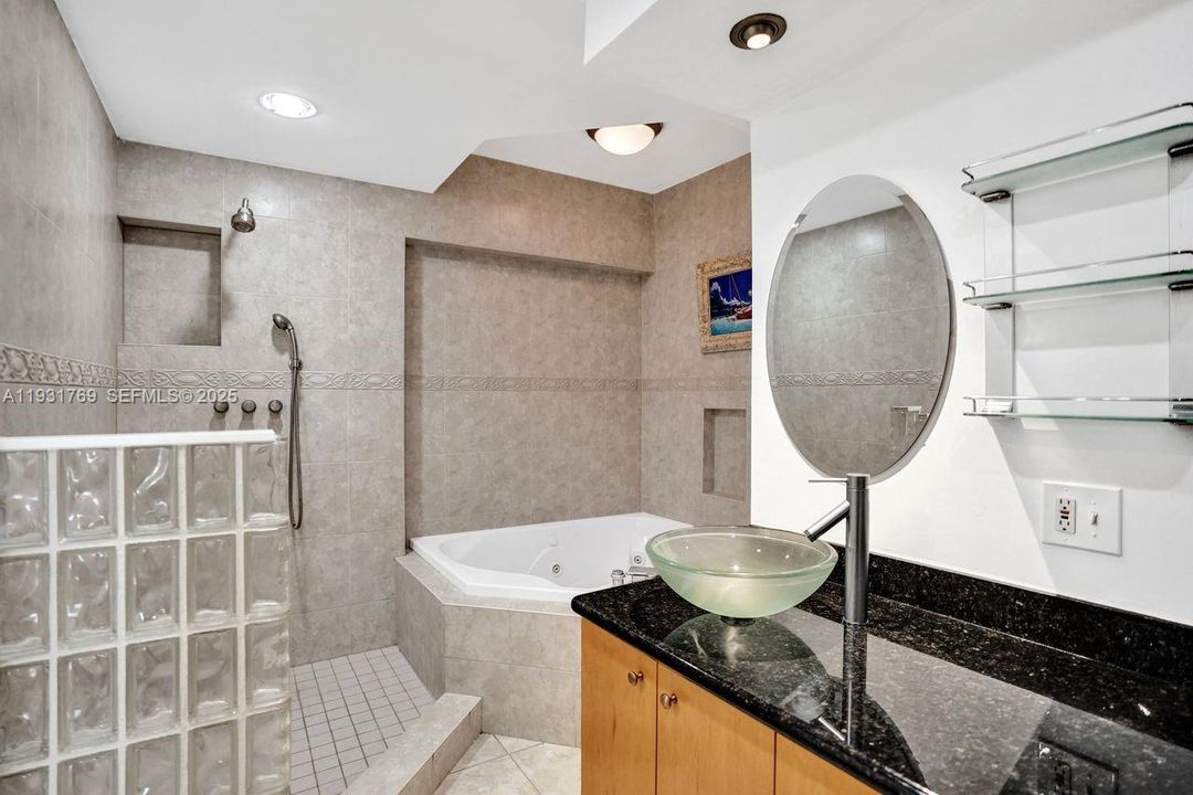 Separate soaking tub and shower.