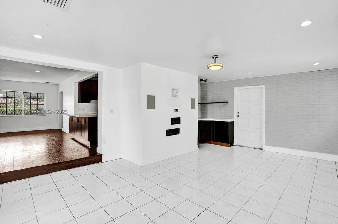 Large family room with built in bar. Opens to living area.