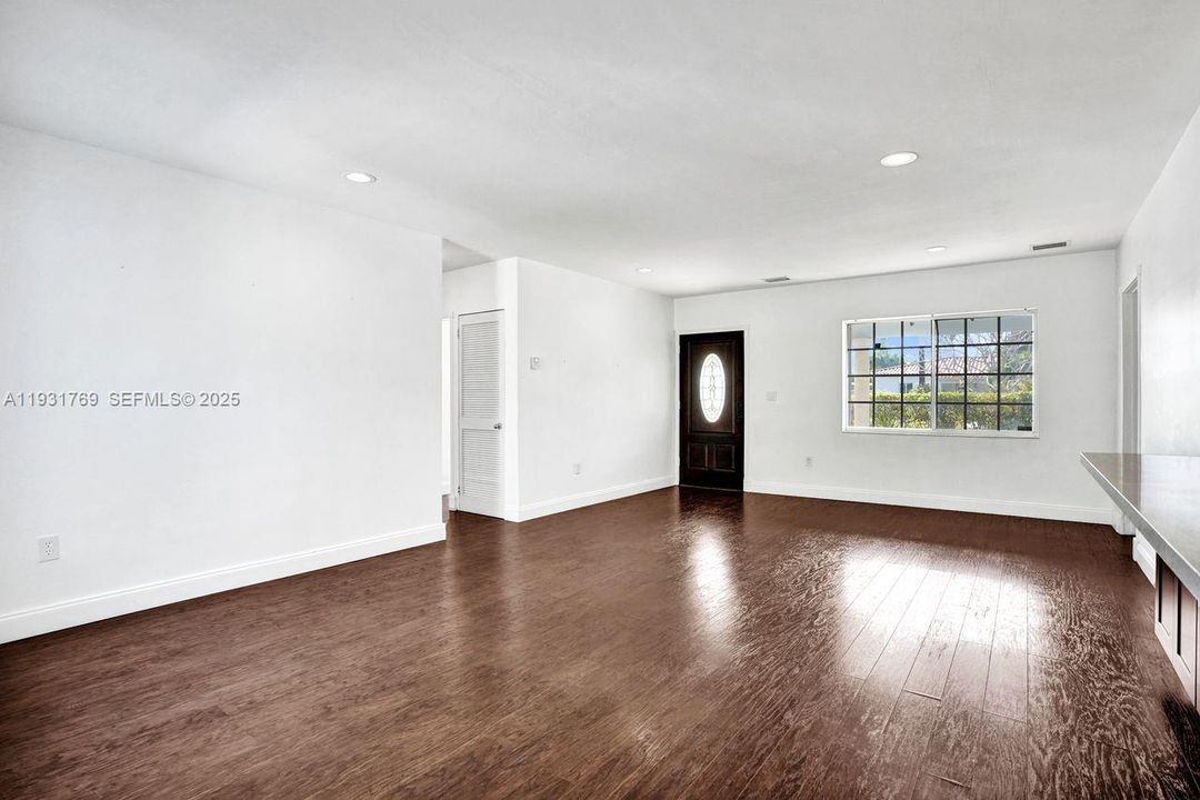 Ample dining/living facing front door.