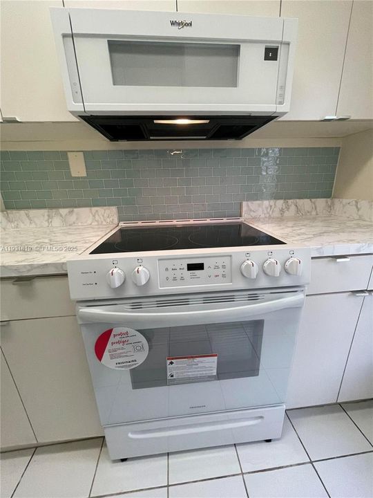 NEW RANGE AND MICROWAVE-NEVER USED BEFORE
