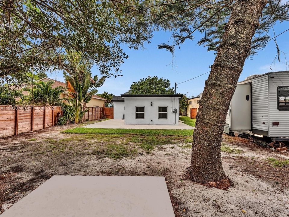 Backyard is ready to create your own oasis. Large Concrete patio surrounding the house.