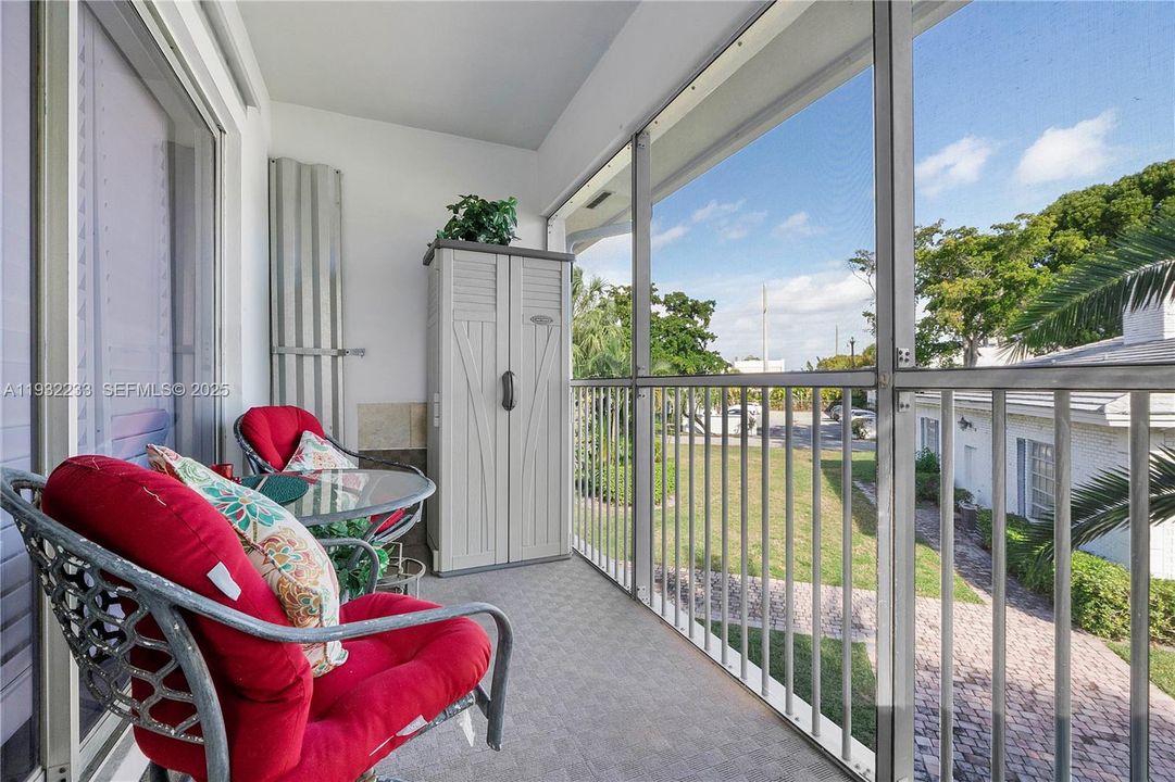 Screened in balcony overlooking garden
