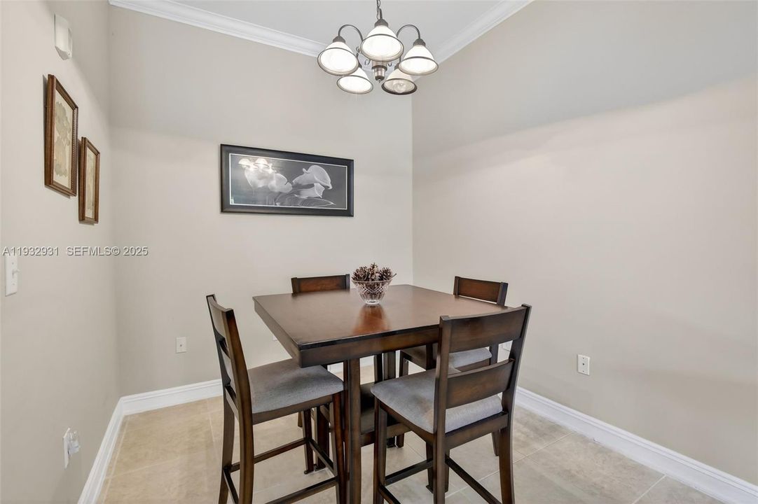 Cozy dining area can accommodate larger table and more seating if needed.