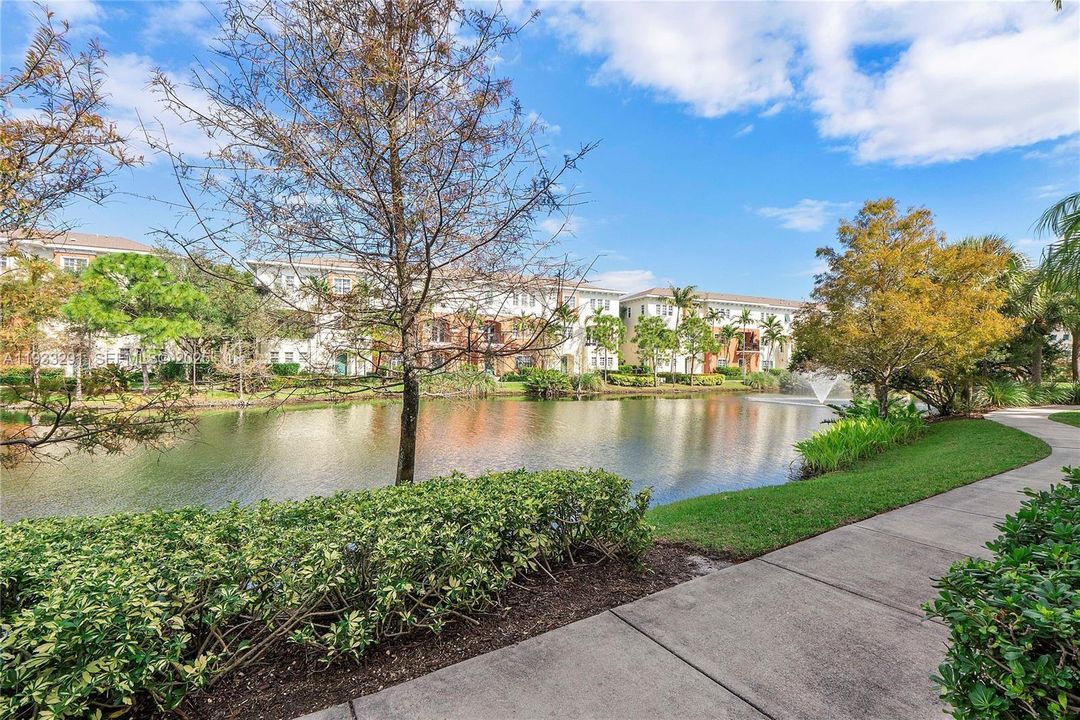 serene sidewalk views around lake.