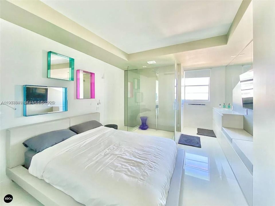 2nd Bedroom with glass enclosed shower and enclosed toilet