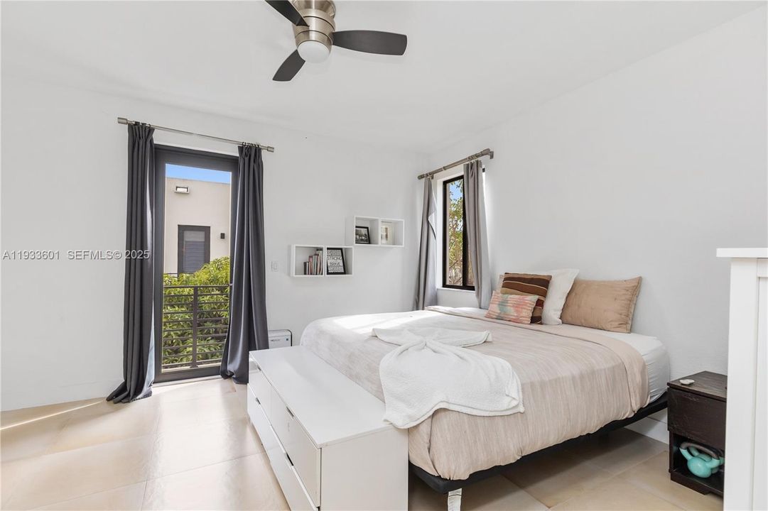 Primary bedroom with balcony