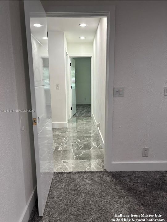 Hallway from Primary bedroom to second bedroom