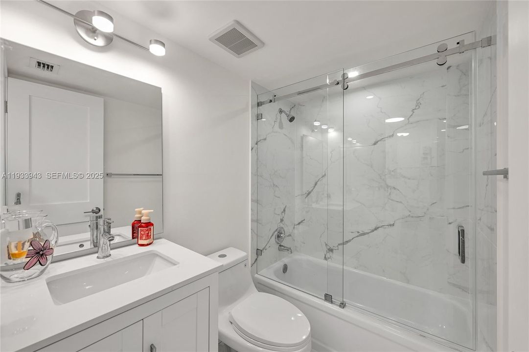 The guest bathroom has been remodeled with no expense spared.