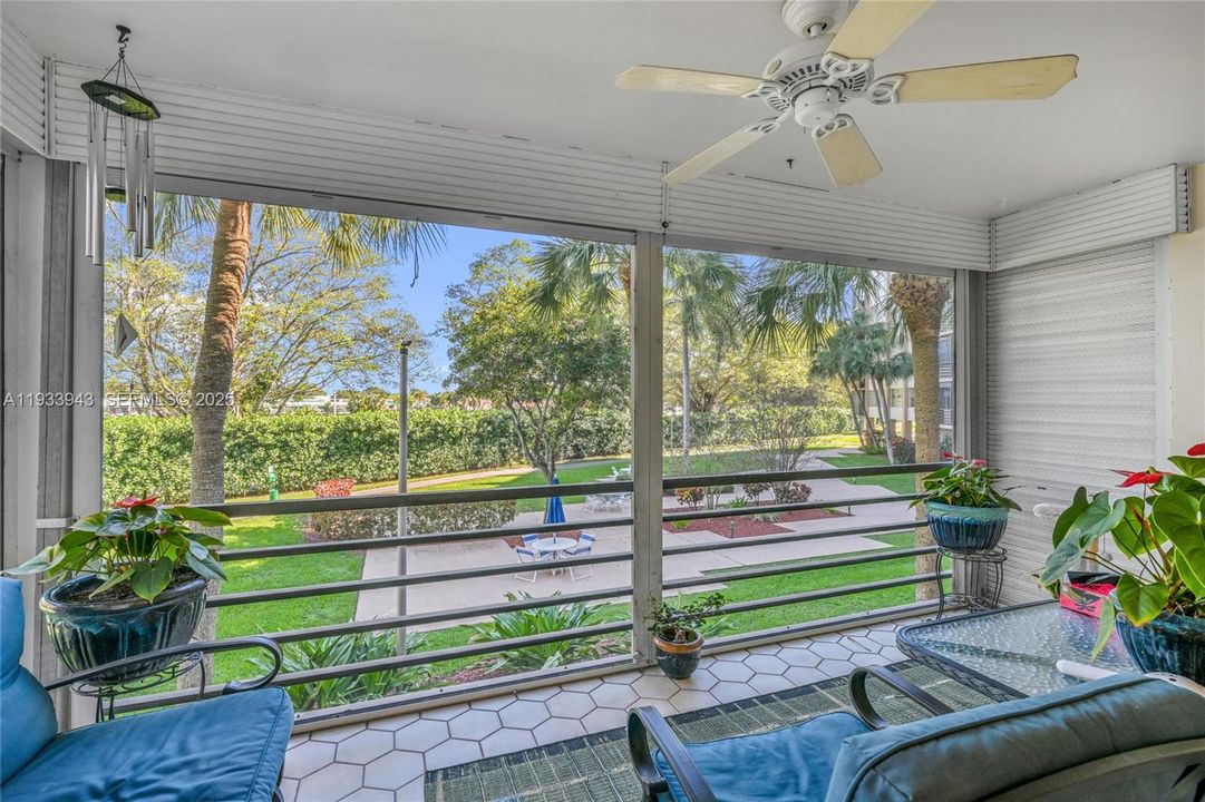 Screened in Balcony with a Garden View