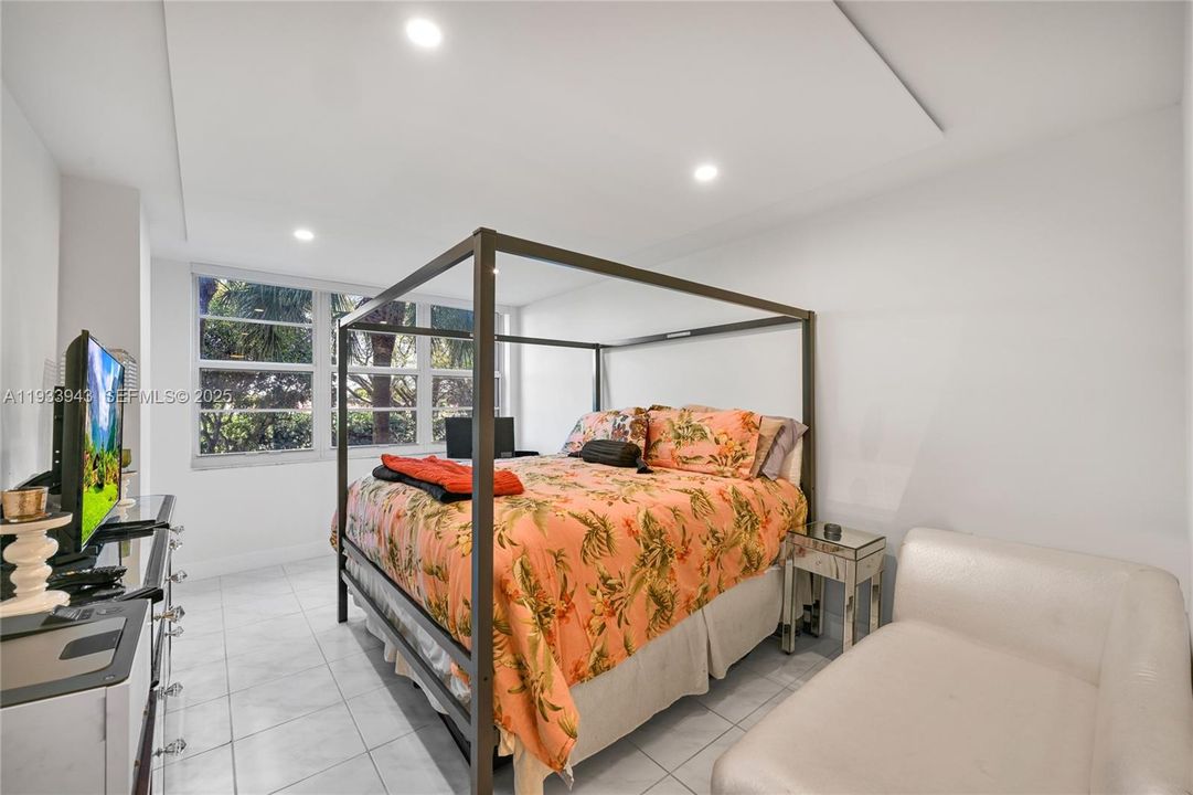 Enjoy waking up to garden views in this bright and spacious primary suite.