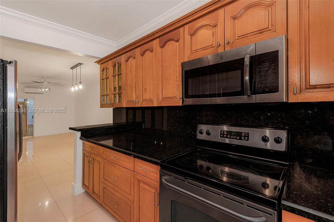 The stove and microwave have convenient counter top for handling food before and after cooking. The kitchen leads into the Dining/Living room area to enjoy your meals.