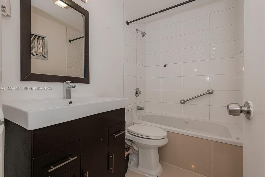 This full bath has a jacuzzi tub to relax you with jets of water, if you want.