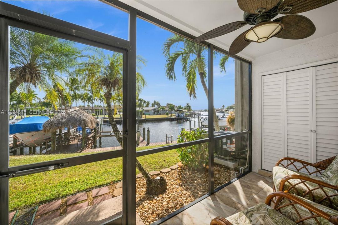 Screen Porch with a view down the Gulf Access Canal