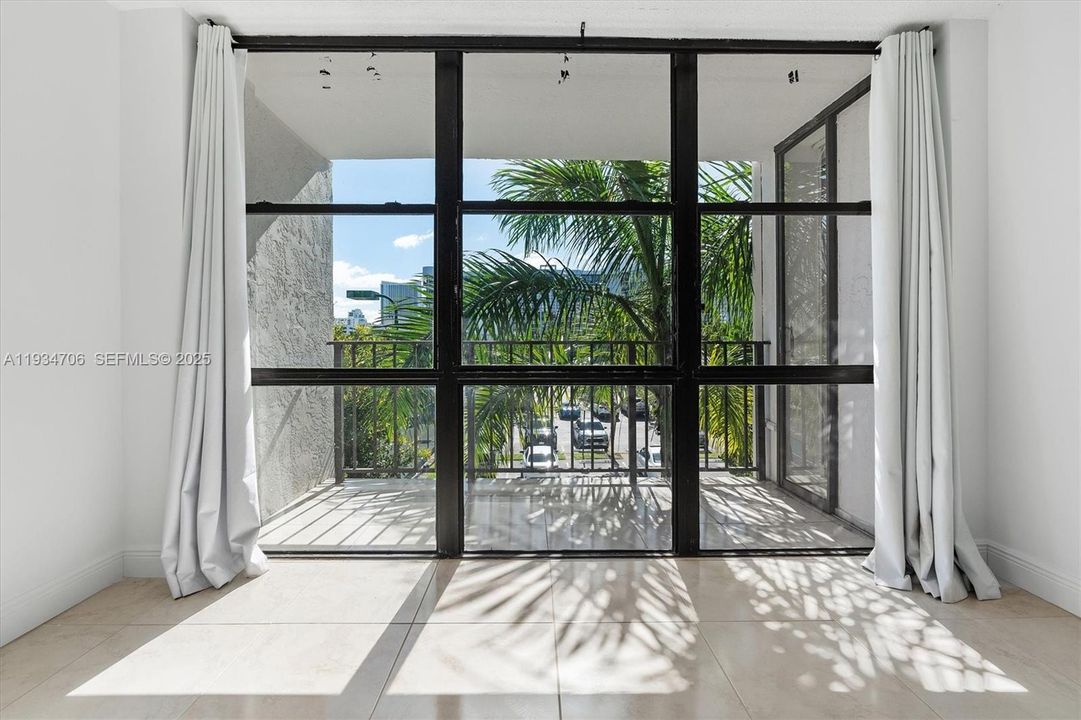 Den in the Bedroom with Balcony View