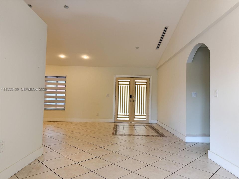 Dining room looking towards living room and entrance to home
