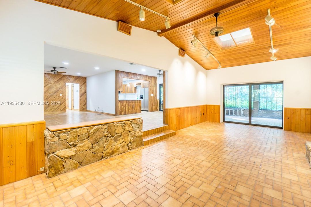 Family Room with Vaulted Ceilings and Skylight