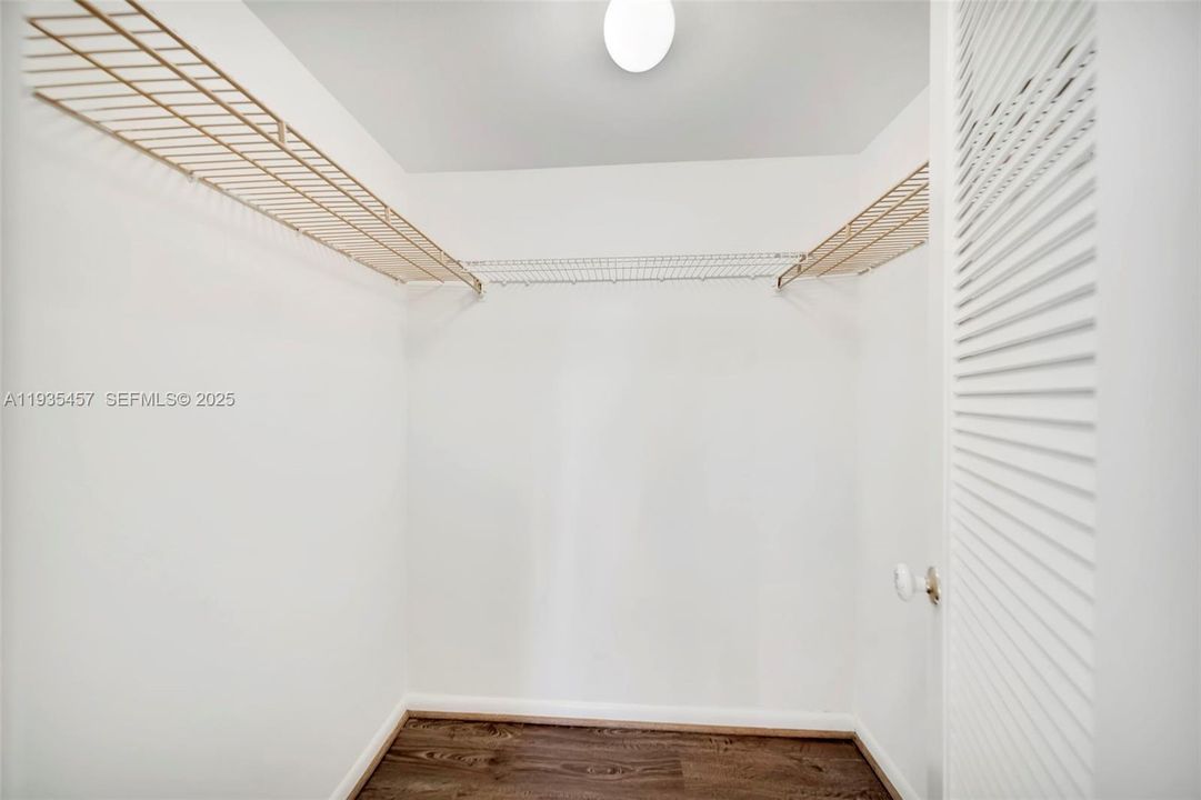 Primary Bedroom walk-in closet