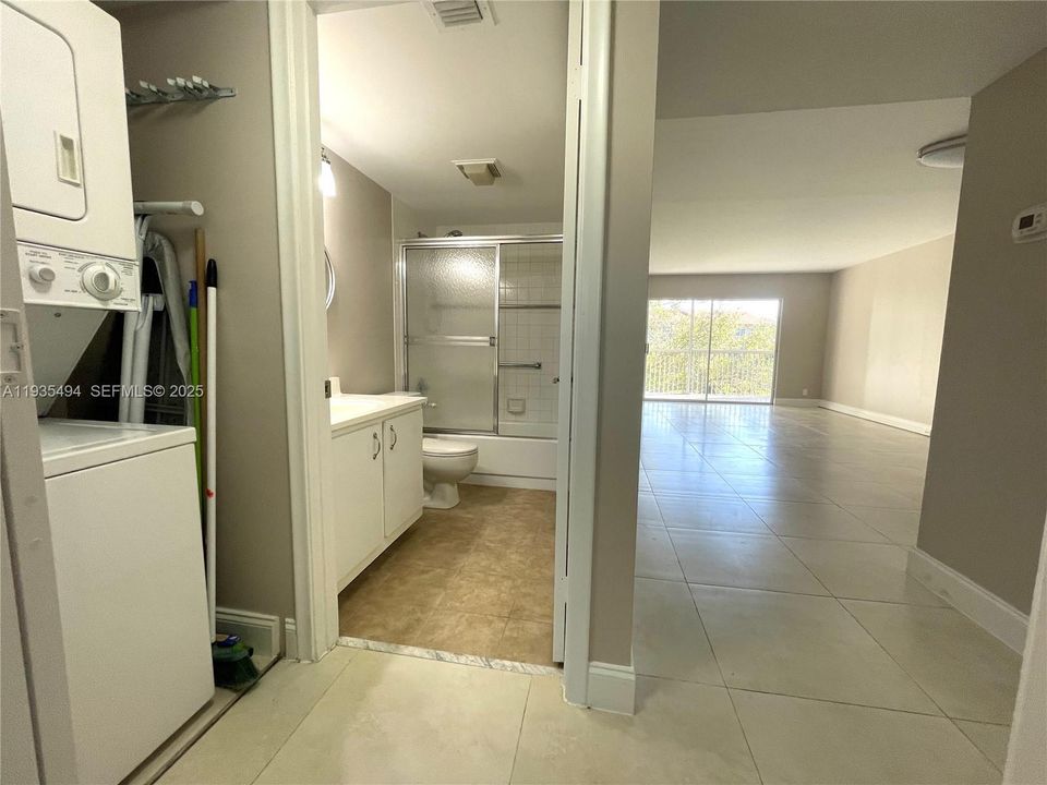 FRONT BATHROOM W/D AND LIVING AREA VIEW