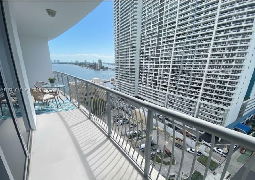 Private balcony with city and partial bay views.