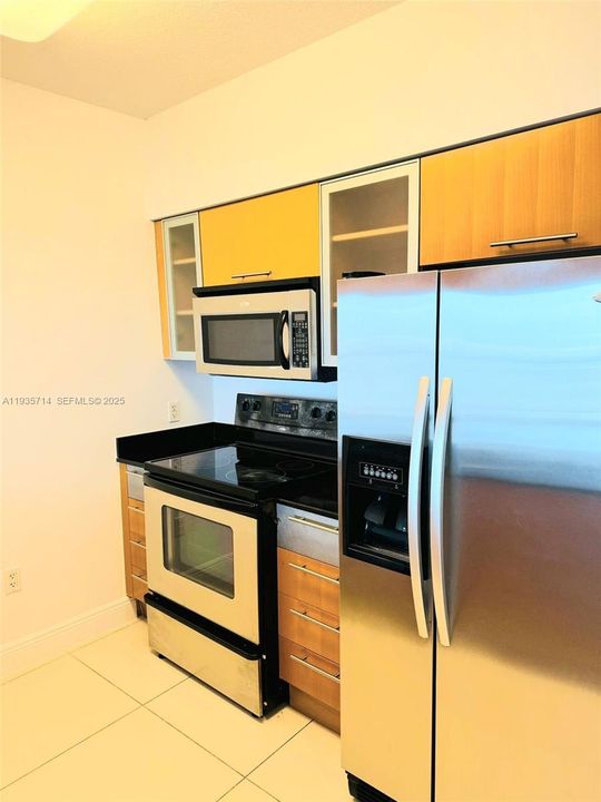 Additional kitchen angle with ample storage.