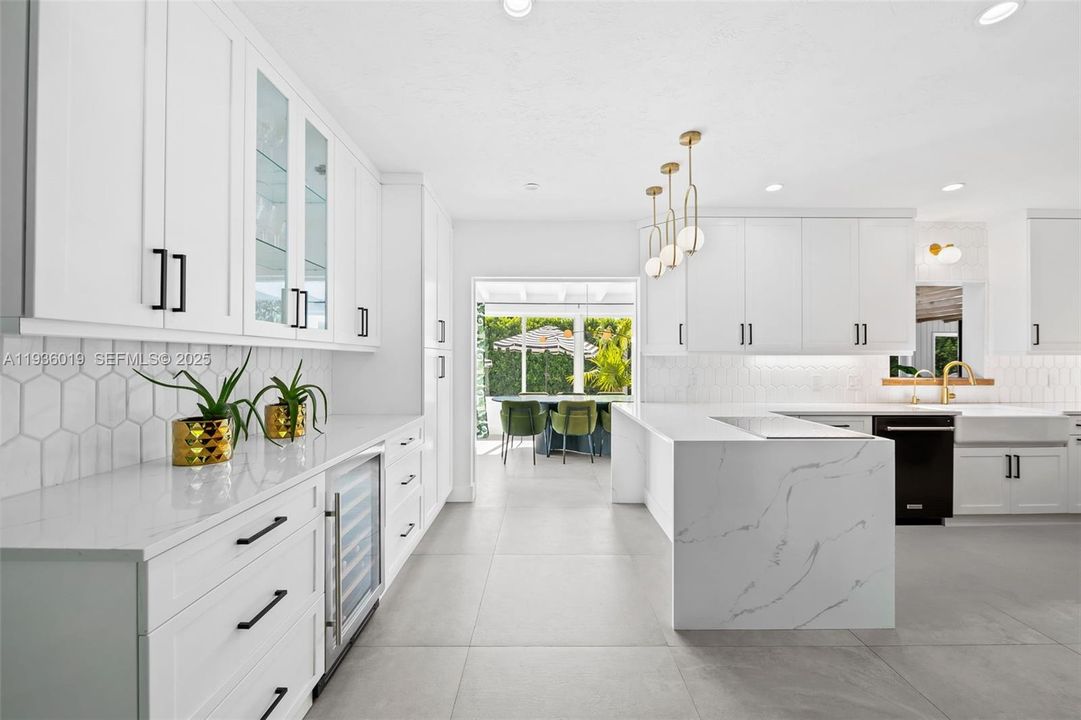 View from formal living to kitchen and formal dining.