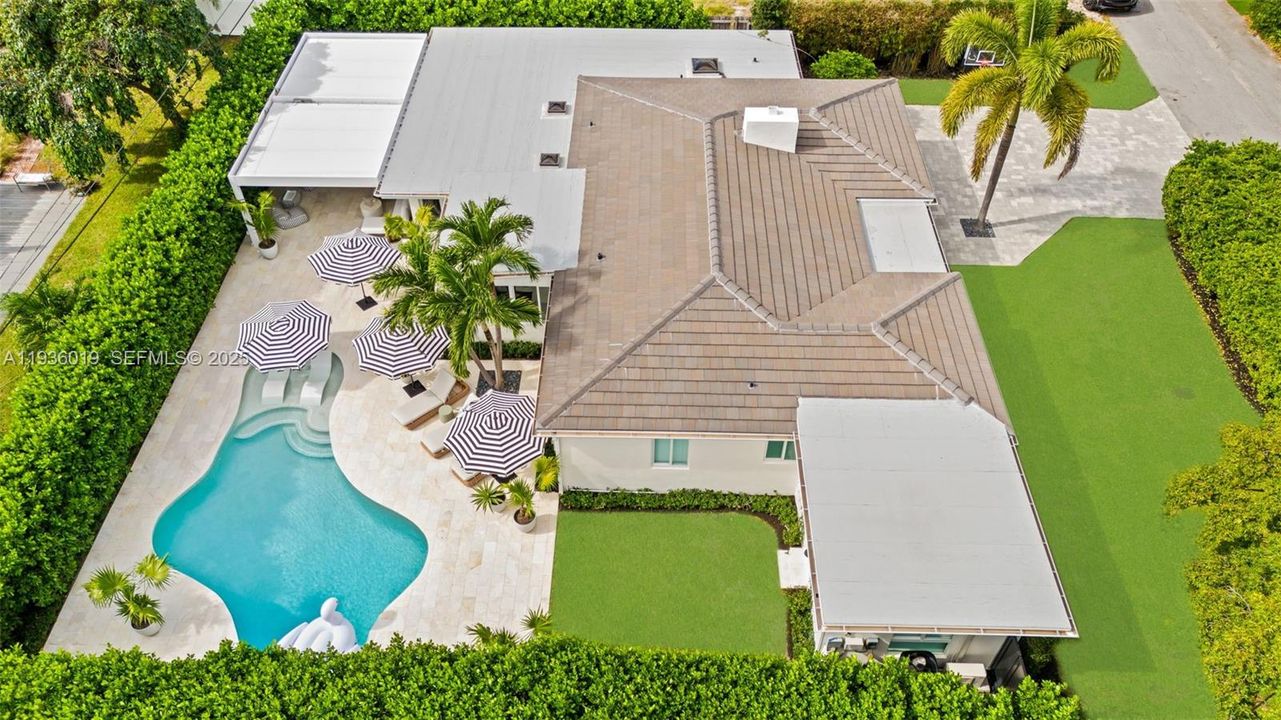 Aerial view featuring 2024 flat tile roof
