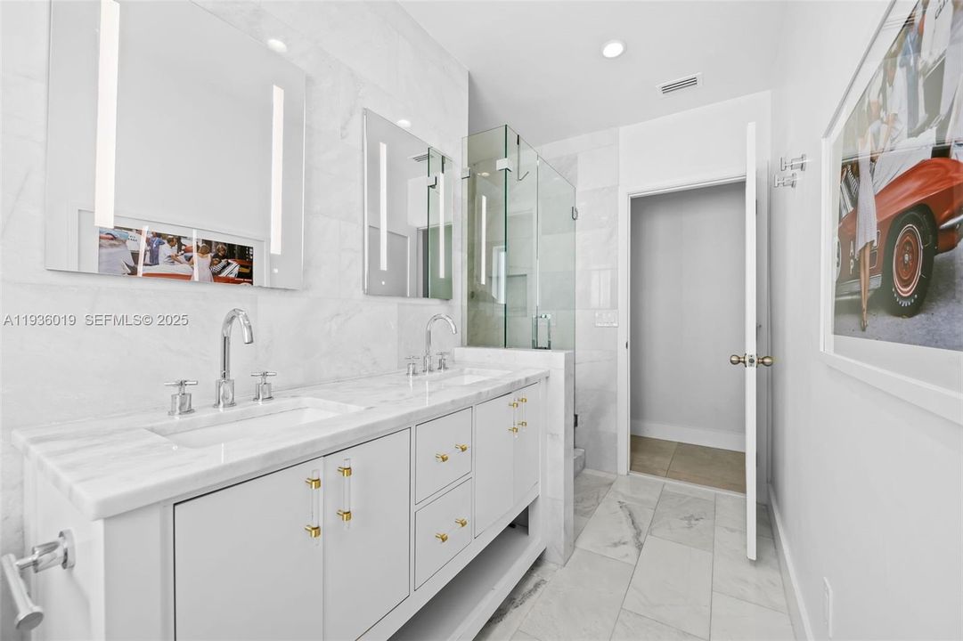 Primary en suite bath featuring dual sinks