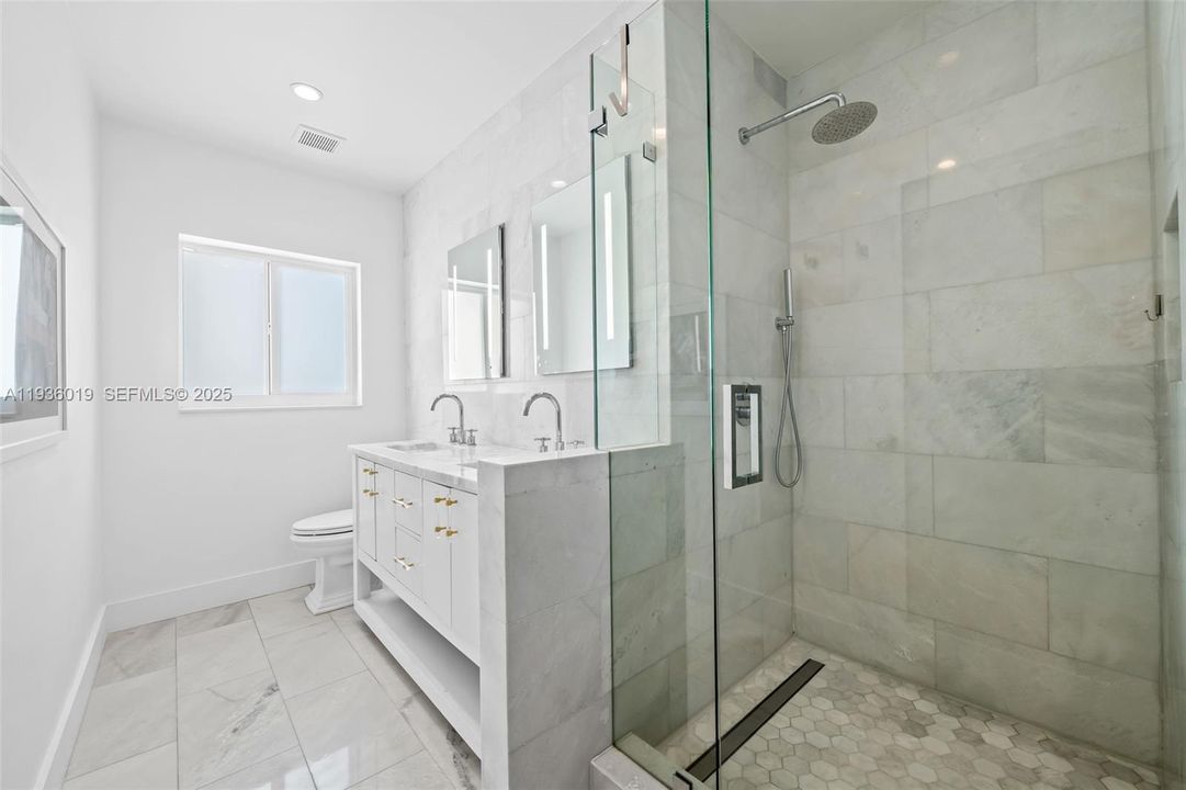 Primary bath featuring stand alone steam shower