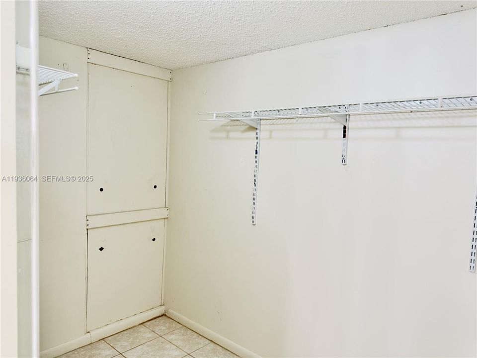 Walk in closet - AC and Water Heater behind panels